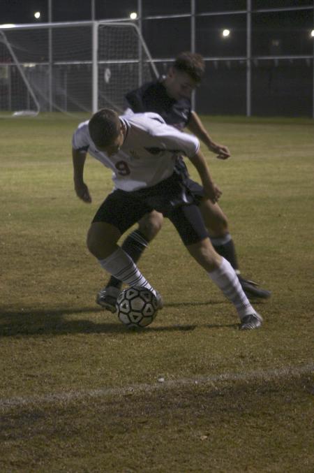 Sophomore Wagner Oliveira and an opponent battle for the ball in a game against Cumberland University, Tenn. - Photo by Stephanie Schroeder