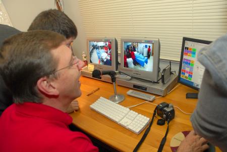 Mark Kossick, professor of nursing and program director of nurse anesthesia, demostrates new equipment during the nursing homecoming reception. - Photo by Morris Abernathy