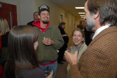 Professor Hal Poe (right) fellowships with Kyle Clark and Rebecca Poe during the Christian Studies Homecoming reception. - Photo by Morris Abernathy