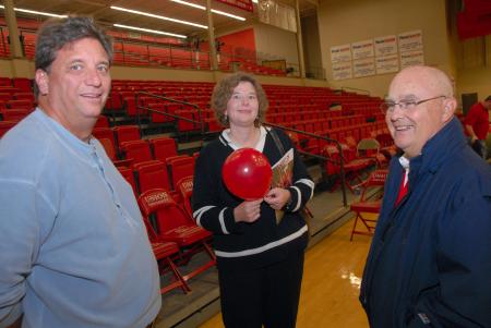 Athletic Director David Blackstock (right) fellowships with Alum Christa Green Goodrich and her husband Don Goodrich during the athletics Homecoming reception. - Photo by Morris Abernathy