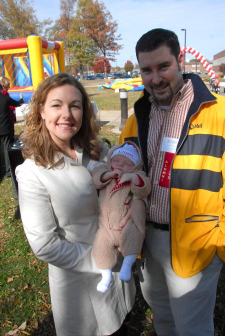Alums Jeff & Tara Owen show off their future Unionite during the Arts in the Park event at Homecoming. - Photo by Morris Abernathy