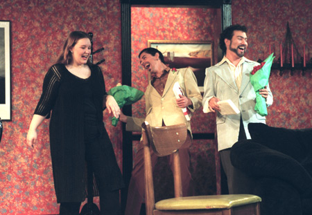 Lindsey Garner welcomes the Spanish brothers played by Ryan Schunemann (Jesus) and Jeremy Young (Manolo) in <i>The Odd Couple.</i> - Photo by Jim Veneman
