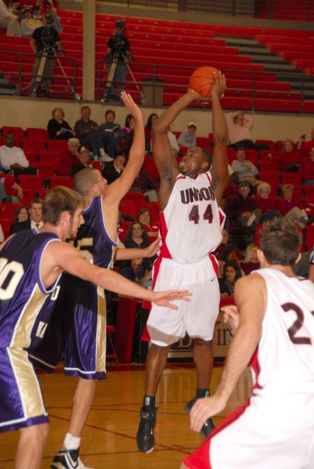 Pierry Valmera (44), Senior center, shoots for 2 of his 22 points versus Olivet Nazarene University (Ill.). - Photo by Morris Abernathy