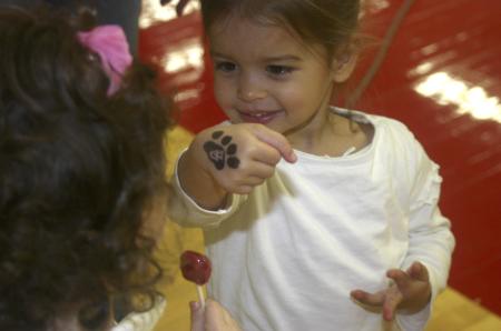 A future Unionite shows off her Bulldog hand stamp during the Homecoming basketball game.  - Photo by Stephanie Schroeder