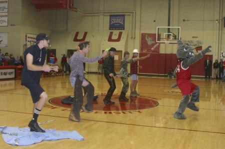 Buster the Bulldog gets a little help from some friends to perform YMCA during the Bulldogs' half time. - Photo by Stephanie Schroeder