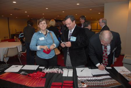 Alum Melody Cain, Mark McSwain and Elzie Danley sign in at the Alumni Reception during the Tennessee Baptist Convention. - Photo by Morris Abernathy