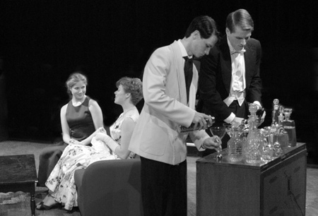 Patrick Myers as Nigel, Earl of Marshwood and Jesse Florida as Honorable Peter Englelton prepare to serve drinks to Amy Calvert as Felicity, Countess of Marshwood and Emily Brown as Miranda Frayle in <i>Relative Values</i>.  - Photo by Jim Veneman