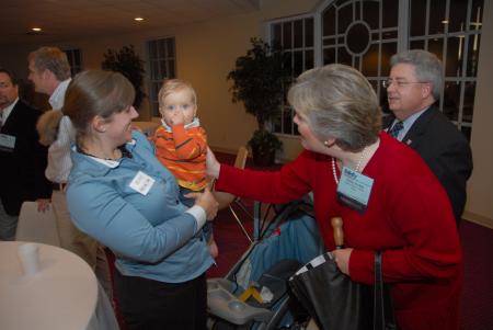 First Lady Lanese Dockery and Randy Phillips greet Alum Melody Cain and her son during the Alumni Reception during the Tennessee Baptist Convention. - Photo by Morris Abernathy