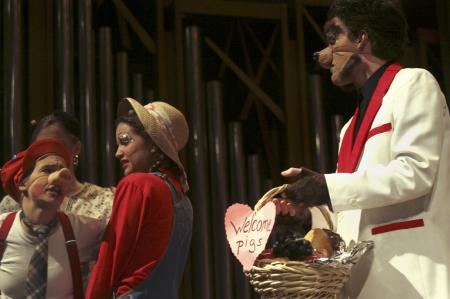 Emily Watlington, as Amadeus the Pig, rejects the wolf's (Andy Morris) neighborly hospitality in <em>The Trial of the Big Bad Wolf</em>. - Photo by Kyle Kurlick