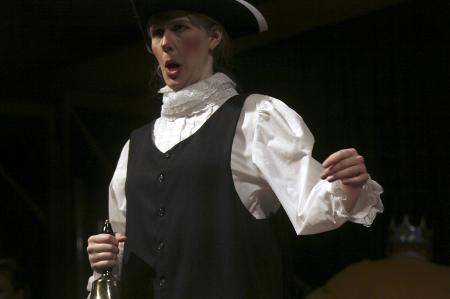 Rachael Kapavik as the Town Crier, one of the three media reporters in the production of <em>The Trial of the Big Bad Wolf</em>. - Photo by Kyle Kurlick