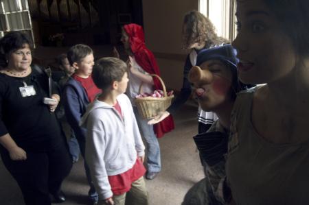 While the audience exits the chapel, the cast of <em>The Trial of the Big Bad Wolf</em> man the exits and thank the children for attending. - Photo by Kyle Kurlick