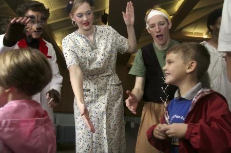 While the audience exits the chapel, cast members  of <em>The Trial of the Big Bad Wolf</em> Andy Morris, Caitlin Riggs and Kip Arrowood man the exits and thank the children for attending. - Photo by Kyle Kurlick