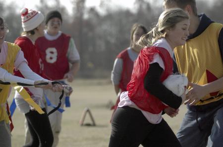Sophomore Kacy Coble gets tackled during the annual Turkey Bowl. - Photo by Holly Gushee