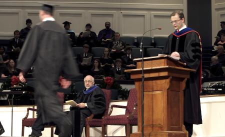Greg Thornbury, dean of the school of Christian studies, calls the names of graduates during fall graduation. - Photo by Kyle Kurlick