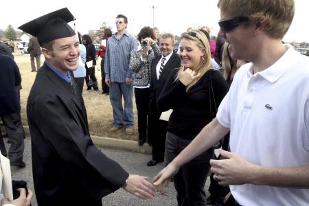 Josh Hogue greets friends and family following the fall graduation ceremony. - Photo by Kyle Kurlick