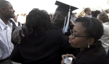 Andrew Harvey, master of arts in education graduate, greets friends and family following fall graduation. - Photo by Kyle Kurlick