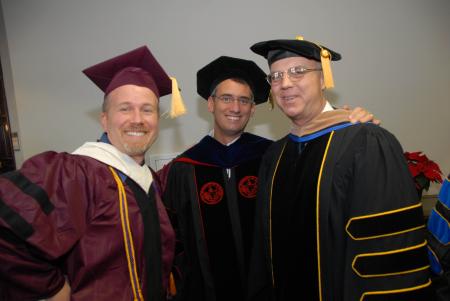 Faculty members Kevin Cooney, Darin White, and Bill Nance show off their academic regalia before the fall graduation ceremony. - Photo by Morris Abernathy