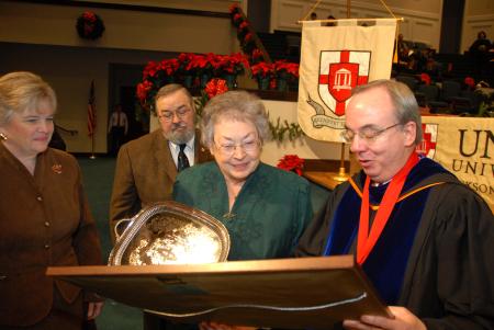 President Dockery presents Emily Cox with the Robert E. Craig Service Award during fall graduation. Cox is a charter member of the Union Auxiliary and a member of First Baptist Church of Paris, Tenn. She is a former special education teacher. - Photo by Morris Abernathy