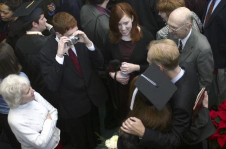 Family members and friends gather together after the graduation ceremony for pictures. - Photo by Stephanie Schroeder