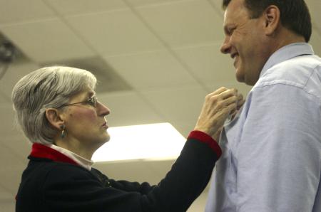 Brent Lewis receives his pin from Tharon Kirk during the nursing pinnning ceremony held before graduation.  - Photo by Stephanie Schroeder