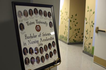 Pictures of the Class of 2006 Nursing Accelerated students welcome families, friends and visitors on their way to the pinning ceremony. - Photo by Stephanie Schroeder