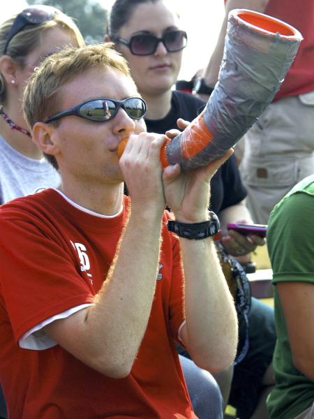Junior Brian Burns, DMS major, makes some noise to support the men's soccer team.   - Photo by Matthew Diggs