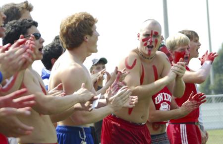 Junior Robert Michael, mathematics major, leads the men of Lambda Chi Alpha in a cheer for the men's soccer team.  - Photo by Matthew Diggs