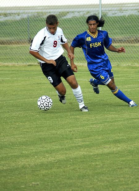 Bulldog Wagner Oliveira dribbles the ball past defenders in a game against Fisk University.  - Photo by Matthew Diggs