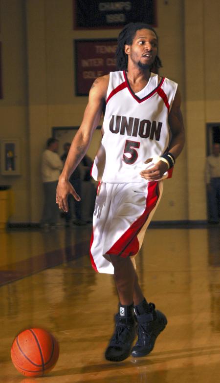 Bulldog Marcus Cooper heads downcourt in a game against  Mid-Continent University (Ky.) - Photo by Matthew Diggs