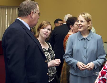 Kimberly Thornbury, dean of students, chats with graduating senior Julie Laugherty and her father during a reception for the fall 2006 graduates.  - Photo by Matthew Diggs