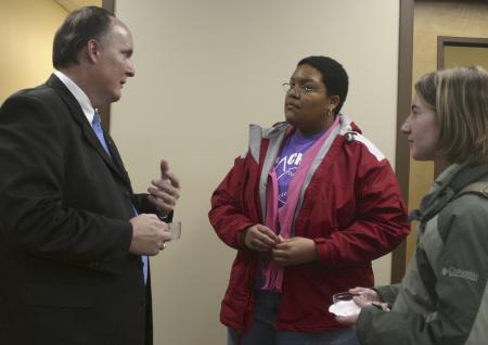 Robbyn Reynolds and Kasey Cobb take a moment after chapel to speak with Jerry Tidwell during a reception held outside the President's Office. - Photo by Stephanie Schroeder