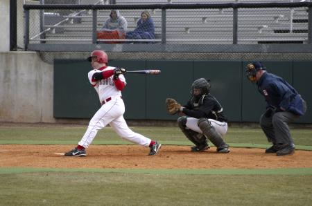 Bulldog Zach Lowery hits a single to left field during the second inning and later steals a base. The Bulldogs finished the game against Southern Virginia University with an 8-3 victory. - Photo by Stephanie Schroeder