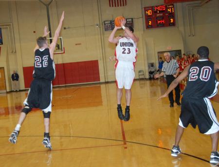 Ryan Merriman takes a three pointer in Union's 76-58 win over Freed-Hardeman in the quarterfinals of the TranSouth Conference Tournament. - Photo by Morris Abernathy