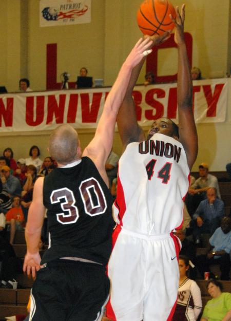 Pierry Valmera (44) goes up for a jumpshot against a Freed-Hardeman defender in the quarterfinal game of the TranSouth Tournament.  Union won 76-58. - Photo by Morris Abernathy