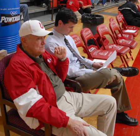 Union Athletic Booster Benny Fesmire and Women's Head Basketball Coach Mark Campbell look over the pre-game situation before the Lady Bulldogs take the court in Fred Delay gymnasium. - Photo by Morris Abernathy