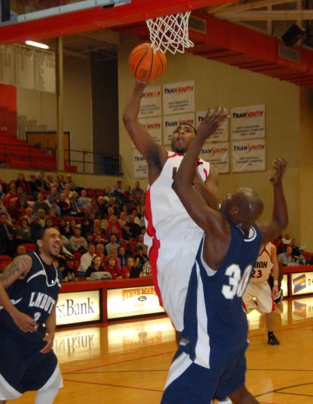 Brian Lake goes up for a shot against the Lambuth defense in the semi-final game of the TranSouth Tournament. - Photo by Morris Abernathy