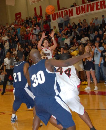 Ryan Merriman (23) prepares to grab the ball while Pierry Valmera (44) fights for position under the goal during overtime of the TranSouth Tournament semi-final game against Lambuth. - Photo by Morris Abernathy