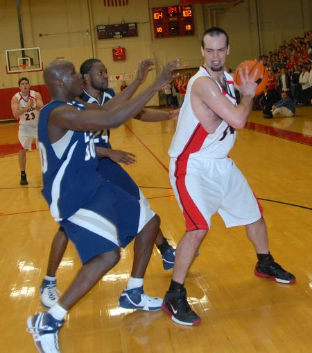 Senior Ben Frederick fights for position against Lambuth during overtime in the semi-final game of the TranSouth Tournament. - Photo by Morris Abernathy