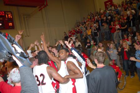 The fans celebrate with the Bulldogs after their OT victory over Lambuth in the semi-final game of the TranSouth Tournament. - Photo by Morris Abernathy