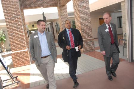 Tim Ellsworth (left) and Mark Kahler (right) of university communications chat with Juan Williams en route to the Union Forum. - Photo by Morris Abernathy