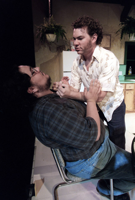 Jeremy Young threatens James Nolen during <i>True West</i>, a Sam Shepherd play directed by Graham Hillard. - Photo by Jim Veneman