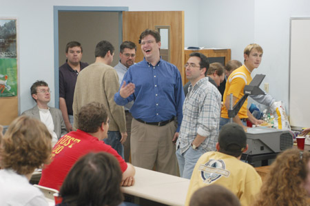 A number of faculty, staff and students gathered to listen to Kirby Atkins talk on computer animation and digital filmmaking.  Pictured here with Kirby is Chris Blair, assistant professor of communication arts. - Photo by Cam Tracy
