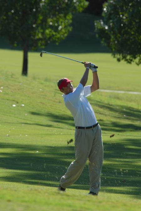 Gary Galapa follows through on one of his shots from the fairway during the Union Invitational at Falcon Ridge Golf Club. - Photo by Morris Abernathy