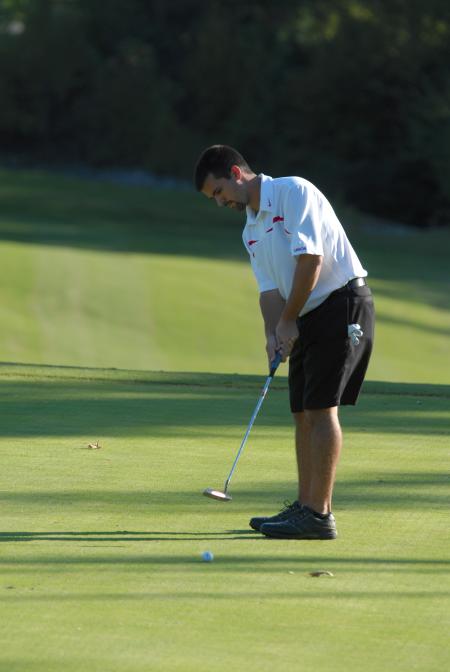 Matt Wood watches the track of the ball after one of his puts in the Union Invitational at Falcon Ridge Golf Club. - Photo by Morris Abernathy