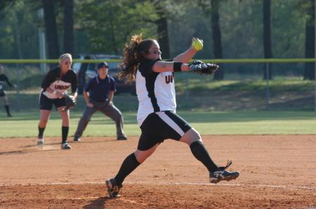 Cassie Turley makes a pitch while Heidi Bybee (second base) gets ready for the play. - Photo by Steven Aldridge