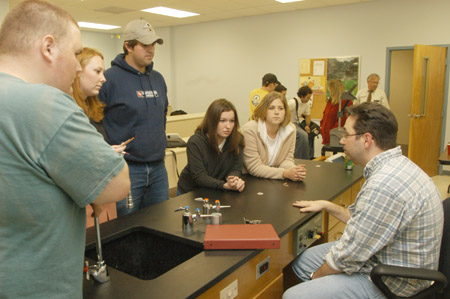 Kirby Atkins speaks with a small group of DMS majors after his talk on computer animation and digital filmmaking. - Photo by Jim Veneman