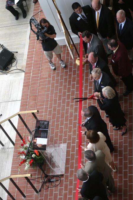 Those who had a leading role in the development of White Hall prepare for the ceremonial ribbon-cutting. From top to bottom: Jim Moss, West Tennessee Healthcare; Bill Dement, Union Board of Regents; Bob Campbell, Union Board of Trustees; Roy and Martha White, lead donors; President David S. Dockery; Elsie Smith, associate professor of biology; Frank Wagster, TLM Associates architect; and Harry Smith, Chairman, Union Board of Trustees. - Photo by Stephanie Schroeder