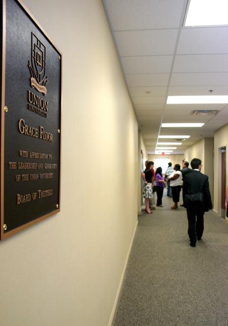 Bronze plaques throughout White Hall make note of the generous donors who gave of their money--and time--to make the $20 million facility possible. This plaque honors the leadership and vision of the Union Board of Trustees. - Photo by Stephanie Schroeder