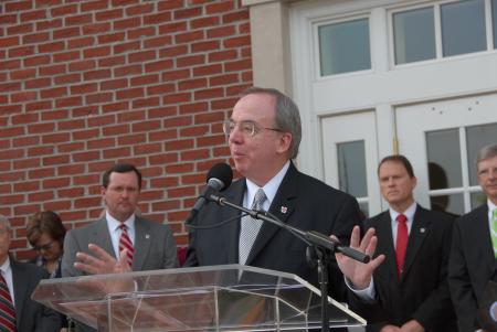 President Dockery presents stats about White Hall during the dedication.  The 63,345 square foot building contains 66 miles of electrical wiring and 23 miles of networking cabling. - Photo by Morris Abernathy