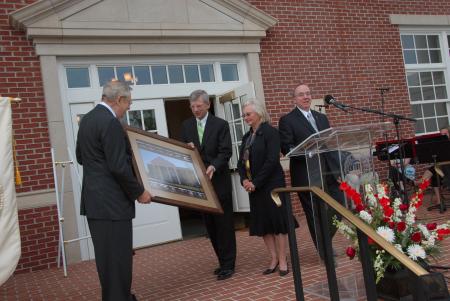 President David S. Dockery and Board of Trustees Chairman Harry Smith present a portrait of White Hall to Roy and Martha White. The Whites made the lead gift for the new science building that bears their name. - Photo by Morris Abernathy